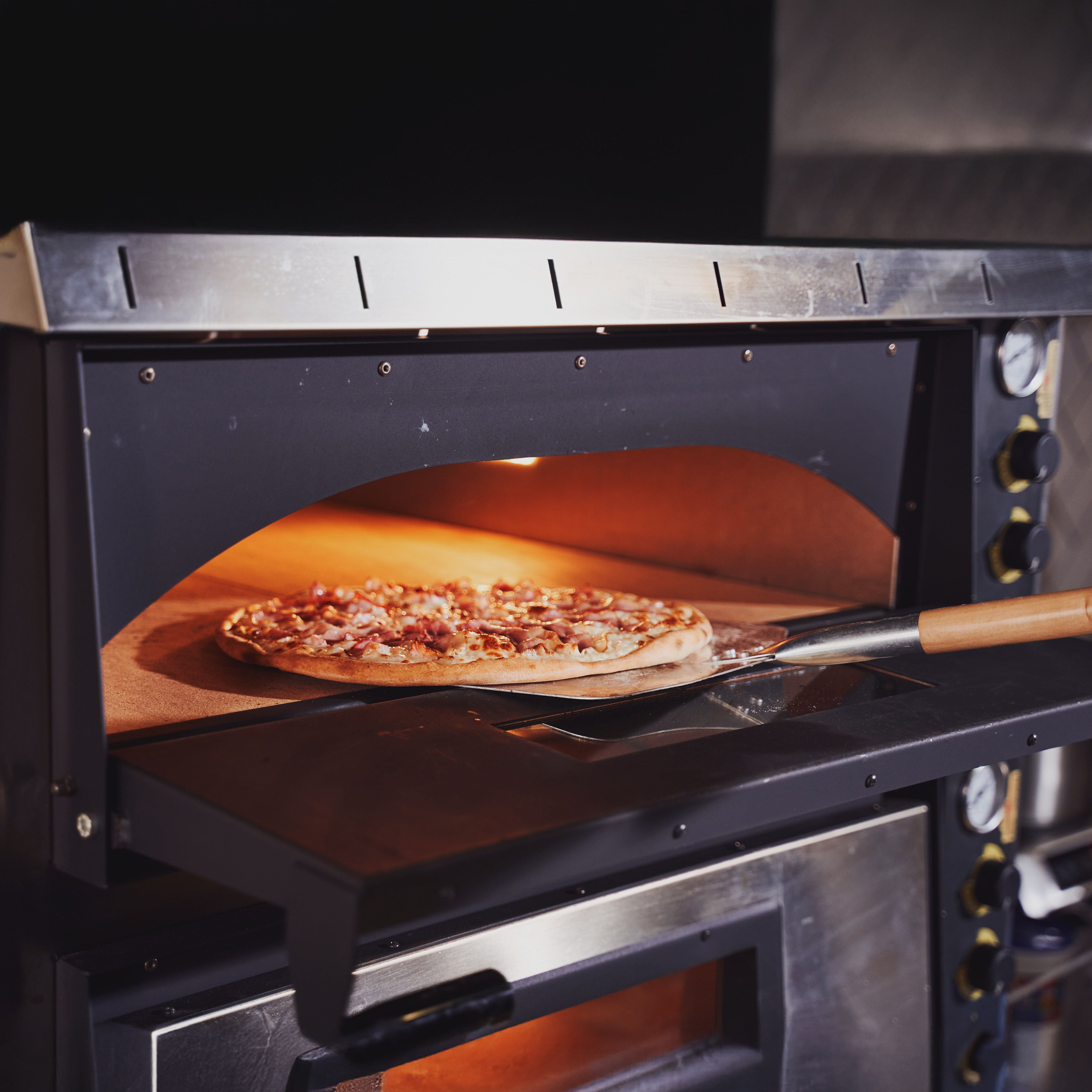 Baking tasty italian pizza concept